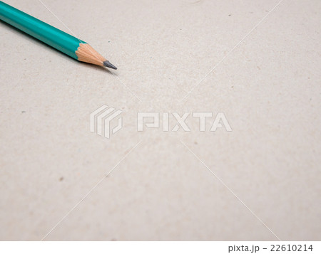 Blank paper and green pencil on the wooden table Blank paper and green pencil on the wooden table 22610214