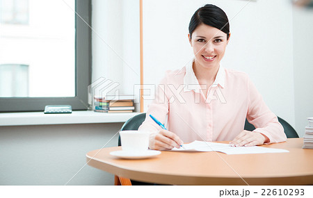 wonam work with papers in office room. wonam work with papers in office room. 22610293