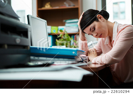 Tired businesswoman sleeping on the desk. Tired businesswoman sleeping on the desk. 22610294