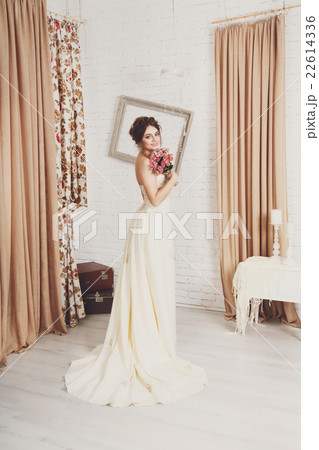 Beautiful young bride in champagne wedding dress Beautiful young bride in champagne wedding dress 22614336