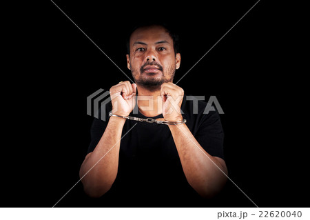 the man was bound by hand in the handcuffed out of freedom 22620040