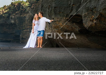 Loving man and woman embracing on sea beach 22622727