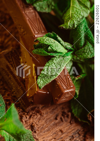stack of chocolate pieces with a leaf of mint  22626001