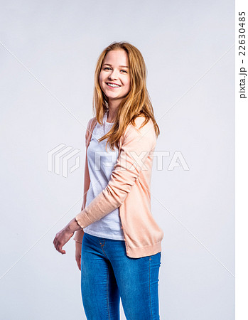 Girl in jeans and cardigan, woman, studio shot 22630485