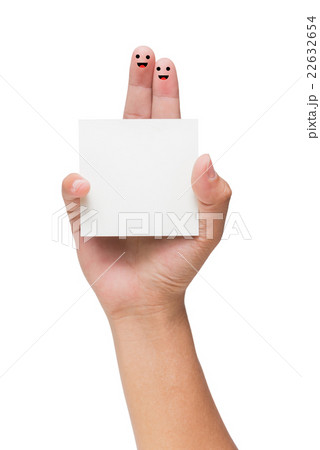 Couple of fingers with painted smiley holding note 22632654