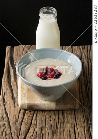 Porridge on a rustic wooden table. Porridge on a rustic wooden table. 22633287