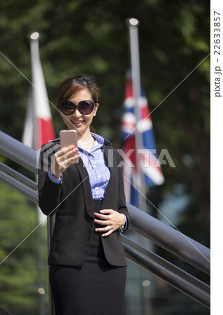 Chinese businesswoman using his Smart phone outdoors. 22633857