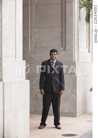 Indian business man in modern Asian city Indian business man in modern Asian city 22634002