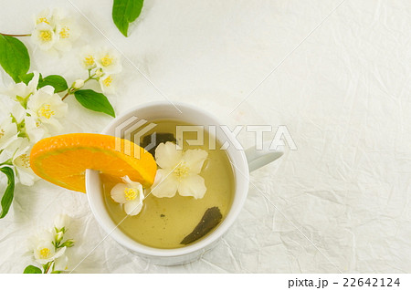 Green tea with jasmine leaf in a cup Green tea with jasmine leaf in a cup 22642124