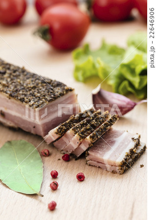 bacon in spices and vegetables 22646906