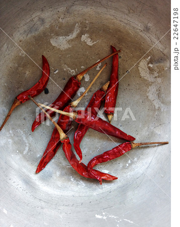 Dried red chillies in old metal bowl 22647198
