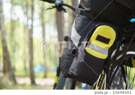 Bicycle tourist with loaded bike 22648301
