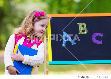 Little girl on her first school day Little girl on her first school day 22649058