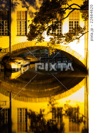 Boat reflection on water canal by night Boat reflection on water canal by night 22664620