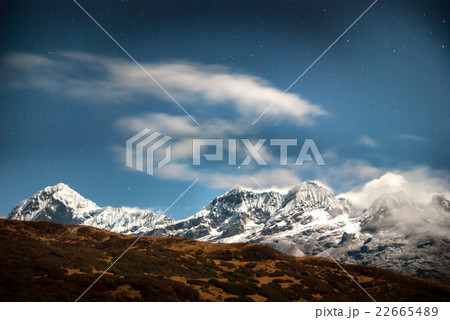 Mountains under night sky with stars 22665489