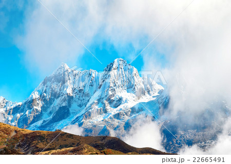 Peaks of mountains, covered by snow. 22665491