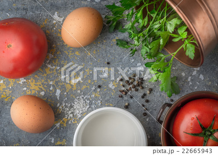 Ingredients for baked eggs with tomatoes top view Ingredients for baked eggs with tomatoes top view 22665943
