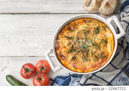 Moussaka in the table with vegetable and bread 22667721