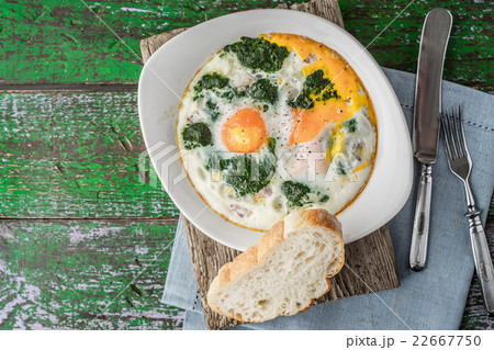 Florentine eggs with pureed spinach on the table  22667750