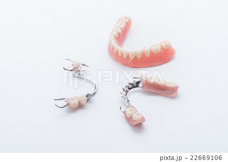 Set of dentures on white background Set of dentures on white background 22669106