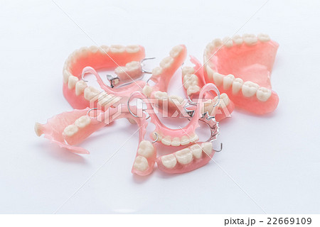 group of dentures on white background group of dentures on white background 22669109