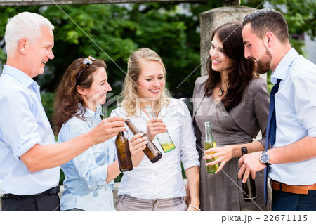 Office colleagues drinking beer after work Office colleagues drinking beer after work 22671115