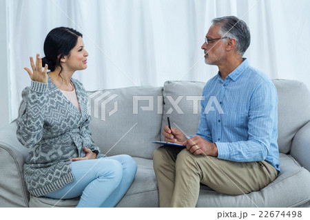 Therapist consoling a woman Therapist consoling a woman 22674498