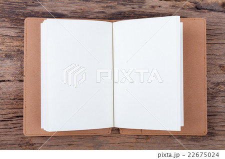 Blank empty notepad on wood background.. 22675024