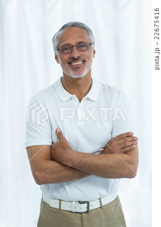 Physiotherapist standing with arms crossed Physiotherapist standing with arms crossed 22675416