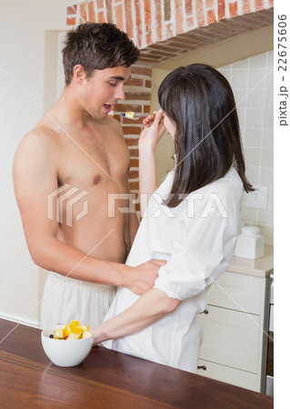 Woman feeding fruits to man Woman feeding fruits to man 22675606