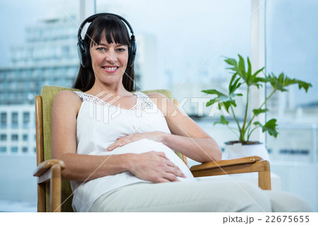 Pregnant woman sitting on chair Pregnant woman sitting on chair 22675655