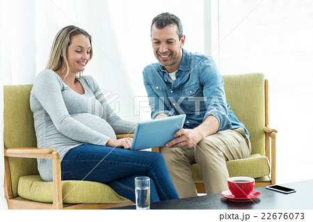 Couple using digital tablet 22676073