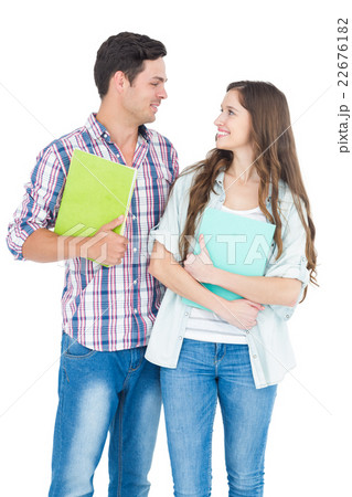 Portrait of students couple holding books Portrait of students couple holding books 22676182