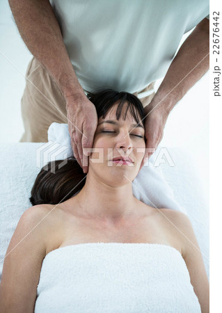 Pregnant woman receiving a massage from masseur Pregnant woman receiving a massage from masseur 22676442