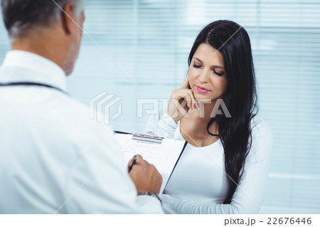 Pregnant woman interacting with doctor 22676446