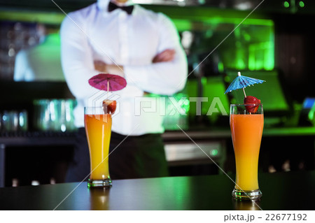 Two glasses of cocktail on bar counter 22677192