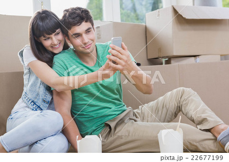 Young couple using mobile phone 22677199