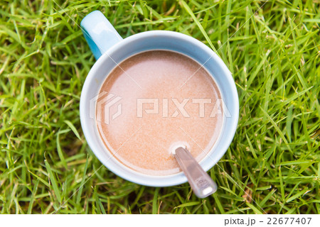 Hot coffee on grass Hot coffee on grass 22677407