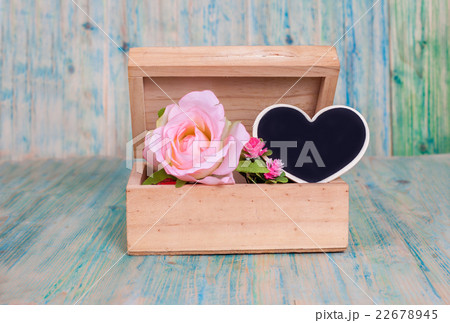 heart shape in box on wooden table 22678945