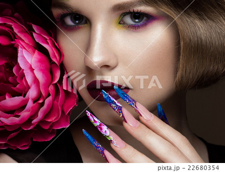 Beautiful girl with colorful make-up, flowers 22680354
