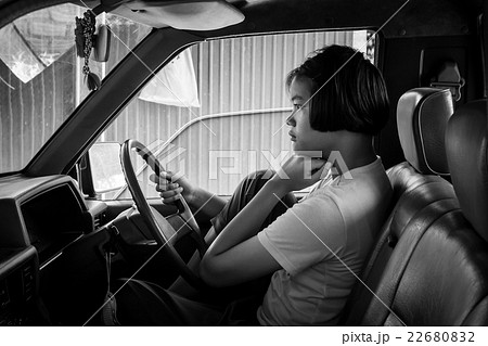asian girl sad alone sitting in the old car 22680832