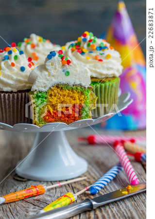 Cupcakes with colorful sprinkles. 22683871
