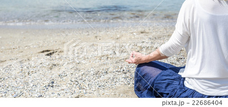 Woman meditating at the sea 22686404