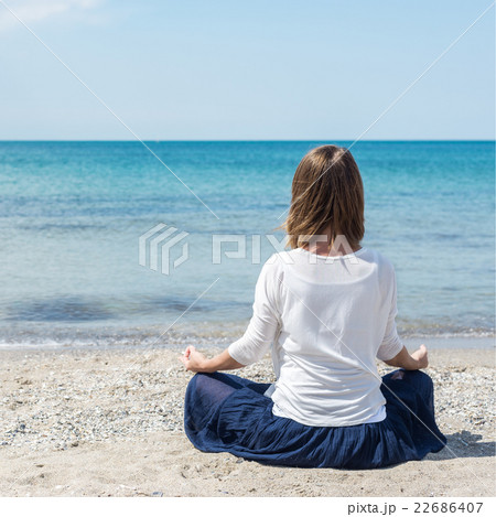 Woman meditating at the sea 22686407