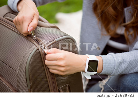 Modern young woman in a park Modern young woman in a park 22689732