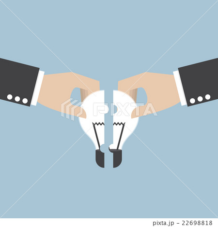 Businessman assembling pieces of light bulb jigsaw Businessman assembling pieces of light bulb jigsaw 22698818