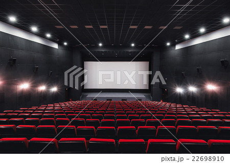 Empty rows of red theater or movie seats. Chairs 22698910