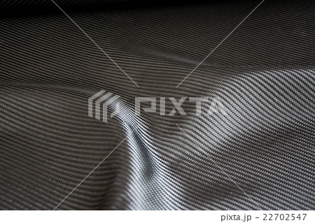 Carbon fiber composite raw material background 22702547