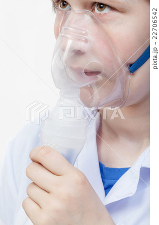 girl breathes with face mask of jet nebulizer girl breathes with face mask of jet nebulizer 22706542
