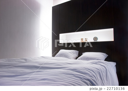 Two pillows Clean and white blanket on Double bed 22710136